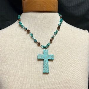 Turquoise beaded necklace 23 inches long.